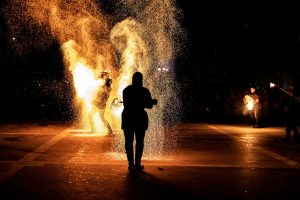 a person standing in front of a fire hydrant
