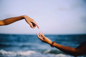 two person holding hands photograph