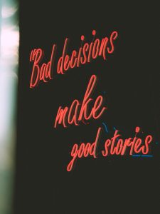 a neon sign that says bad decision make good stories