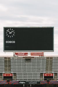 a large scoreboard on the side of a stadium