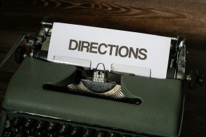 a close up of a typewriter with a piece of paper on it